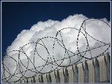 Cloud Behind Barbed Wire
